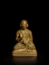 A GILT COPPER ALLOY FIGURE OF THE SECOND PANCHEN LAMA, LOBSANG YESHE PELZANGPO TIBET, CIRCA 18TH...