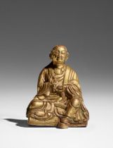 A GILT COPPER ALLOY FIGURE OF ARHAT KALIKA TIBET, 18TH CENTURY