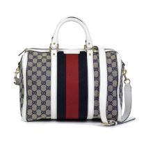 Gucci: a Supreme Monogram Canvas and White Leather Boston Bag (includes shoulder strap and dust ...