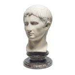 After the Antique: A 19th century Italian carved white marble bust fragment of the young Augustu...