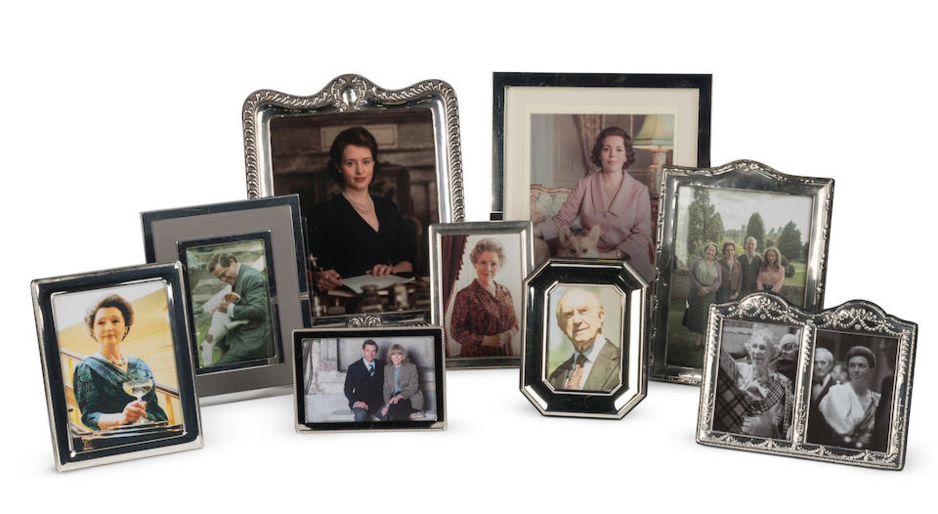 A selection of framed photographs of members of the cast of The Crown in character (9)