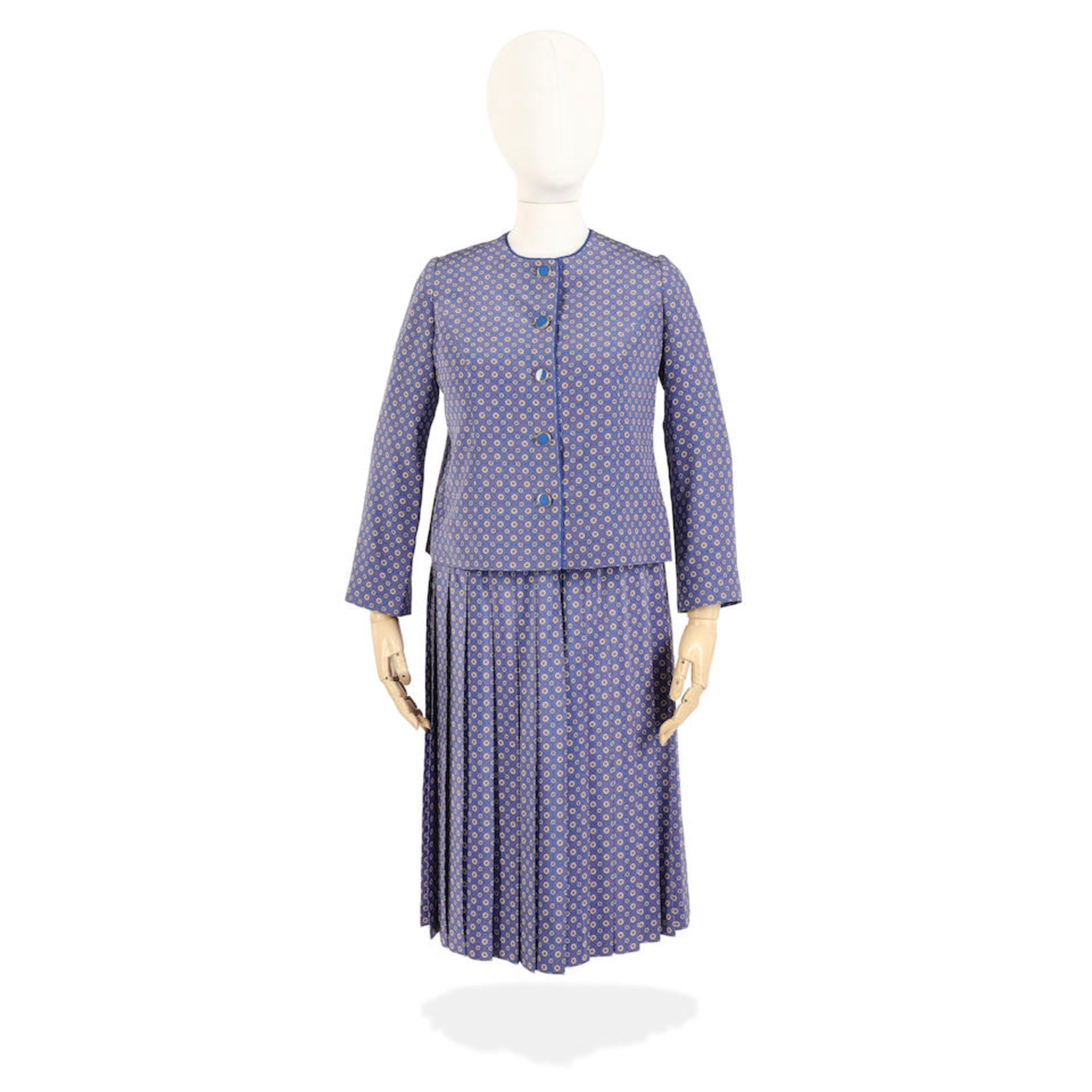 Imelda Staunton (as the Queen): A daisy-print skirt suit Season 6, Episode 7, 'Alma Mater'