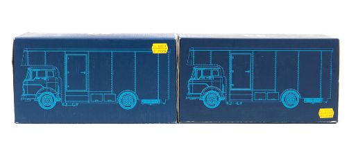 Two boxed 1:43 scale die-cast models of Ferrari and Gelo team race car transporters by Exoto, ...