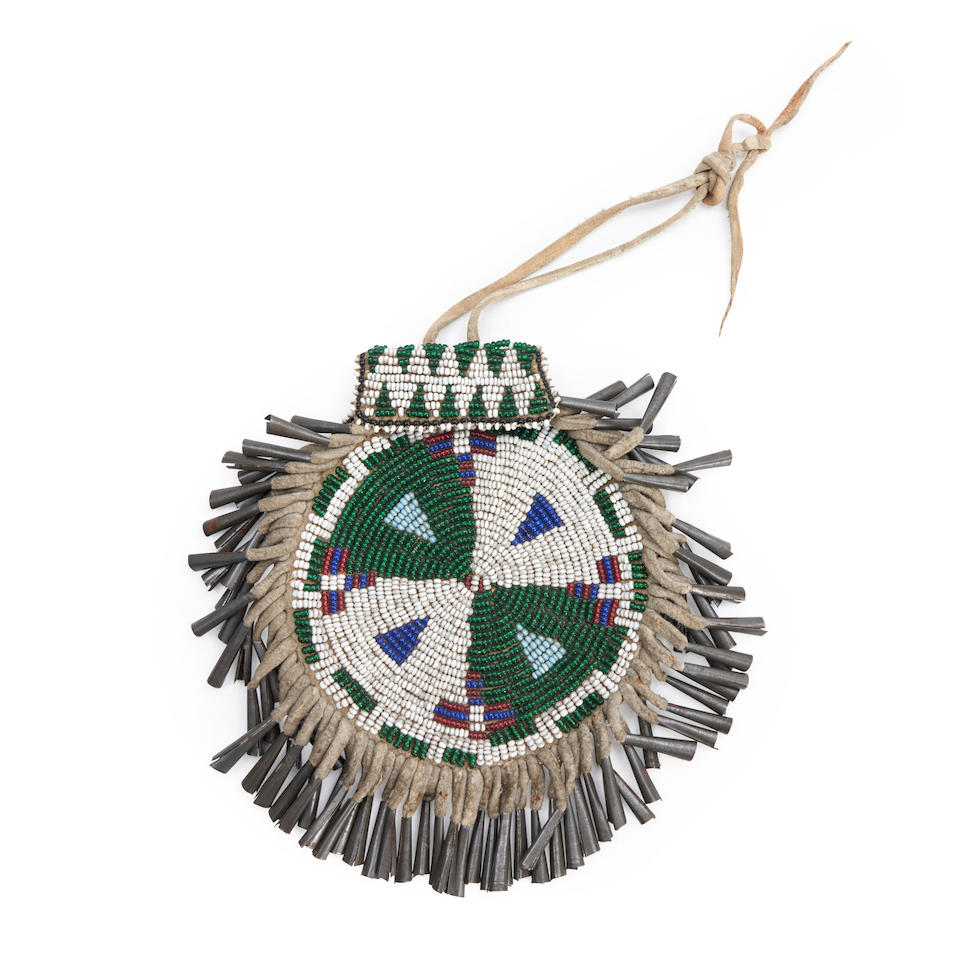An Apache beaded hide pouch ht. 6, wd. 4 in. without fringe.