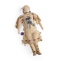 A Plains beaded hide doll ht. 15 in.