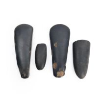 Four New Guinea stone adze blades lg. 8 1/4, 8 1/8, 5 3/4, and 4 in.