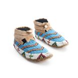 A pair of Plains beaded hide moccasins lg. 9 1/2 in.