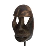 A Dan mask ht. 7 3/4, wd. 3 3/4 in.