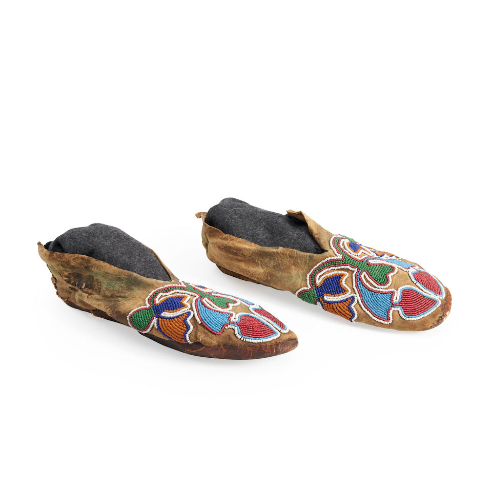 A pair of Prairie beaded moccasins lg. 10 in.
