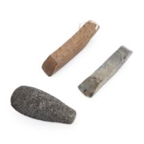 Three Hawaiian stone adze blades ko'i and pestle mea ku'i lg. 10 1/4, 8 3/8, and 8 3/4 in.