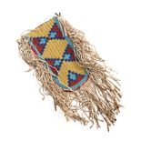 A Central Plains beaded hide pouch lg. incl. fringe 11, wd. incl. fringe 6 in.