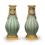 A FINE AND RARE PAIR OF CELADON-GLAZED ORMOLU-MOUNTED VASES The porcelain 18th century, the Fren...