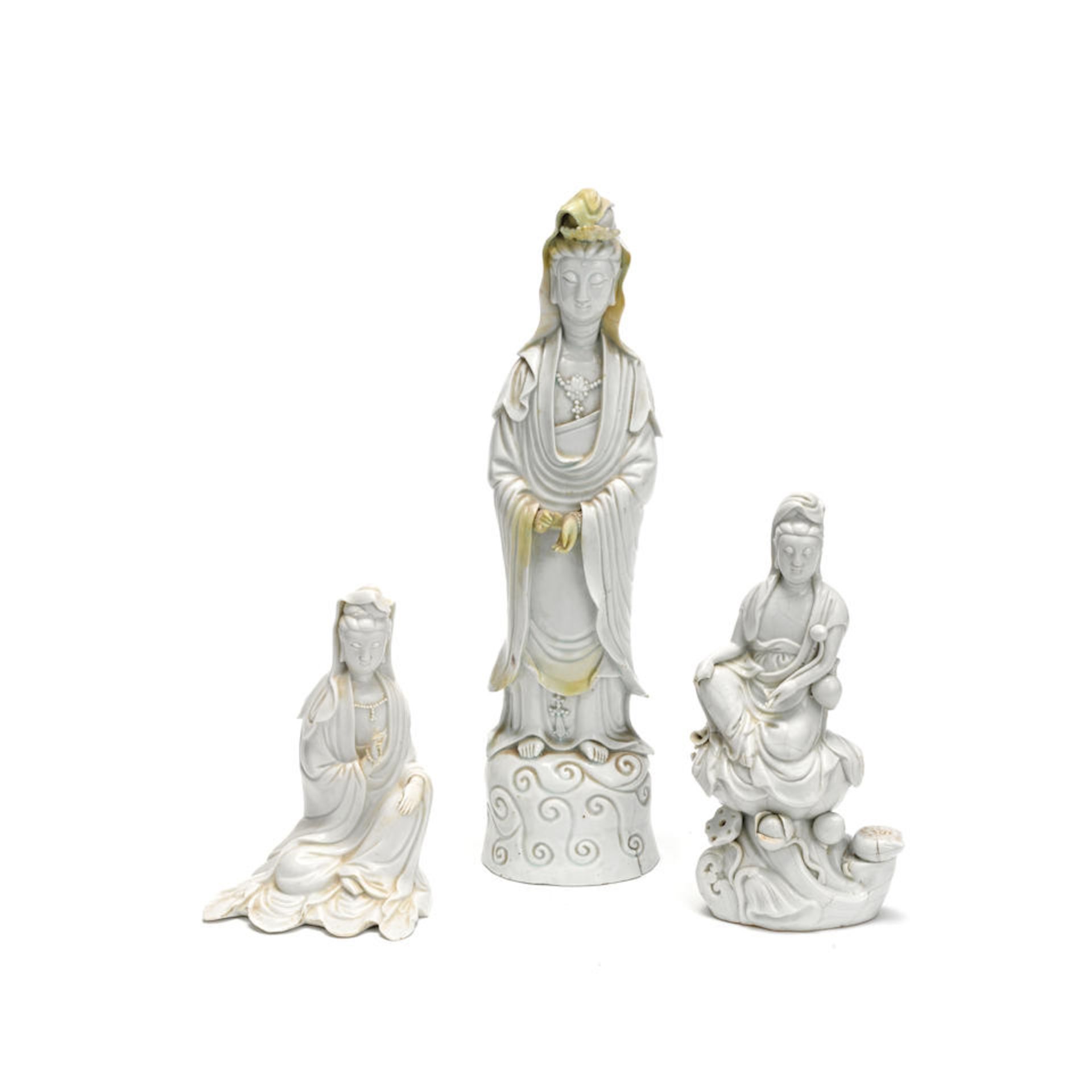 A GROUP OF THREE BLANC-DE-CHINE FIGURES OF GUANYIN 17th century and later (3)