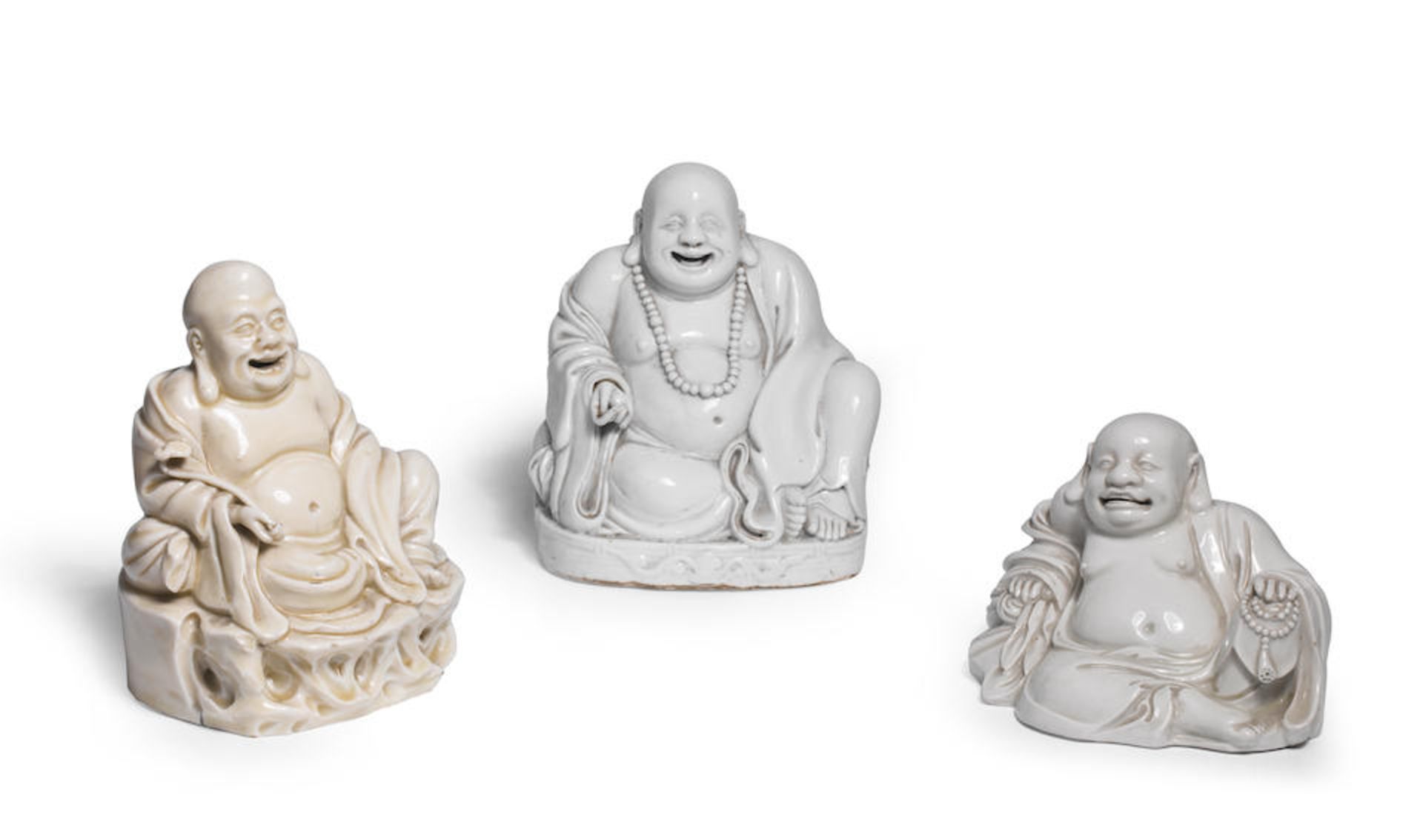 THREE LARGE BLANC-DE-CHINE FIGURES OF BUDAI 17th/18th century (6)