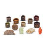 A COLLECTION OF JADE CARVINGS, JADE AND WOOD ARCHERS' RINGS AND A CORAL SNUFF BOTTLE 19th/20th c...