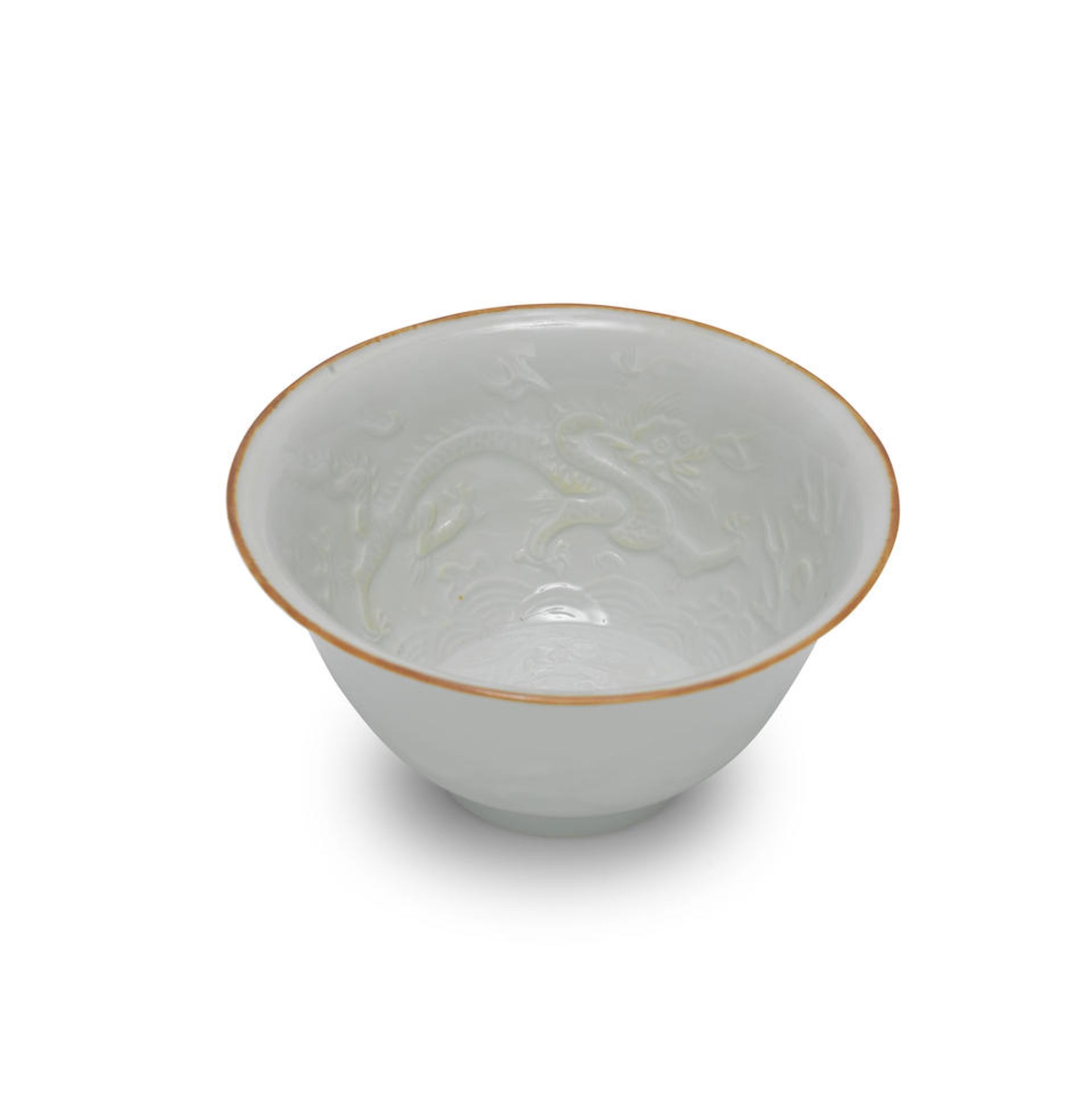 A SMALL MOULDED WHITE-GLAZED DRAGON BOWL Mid-17th century (2)