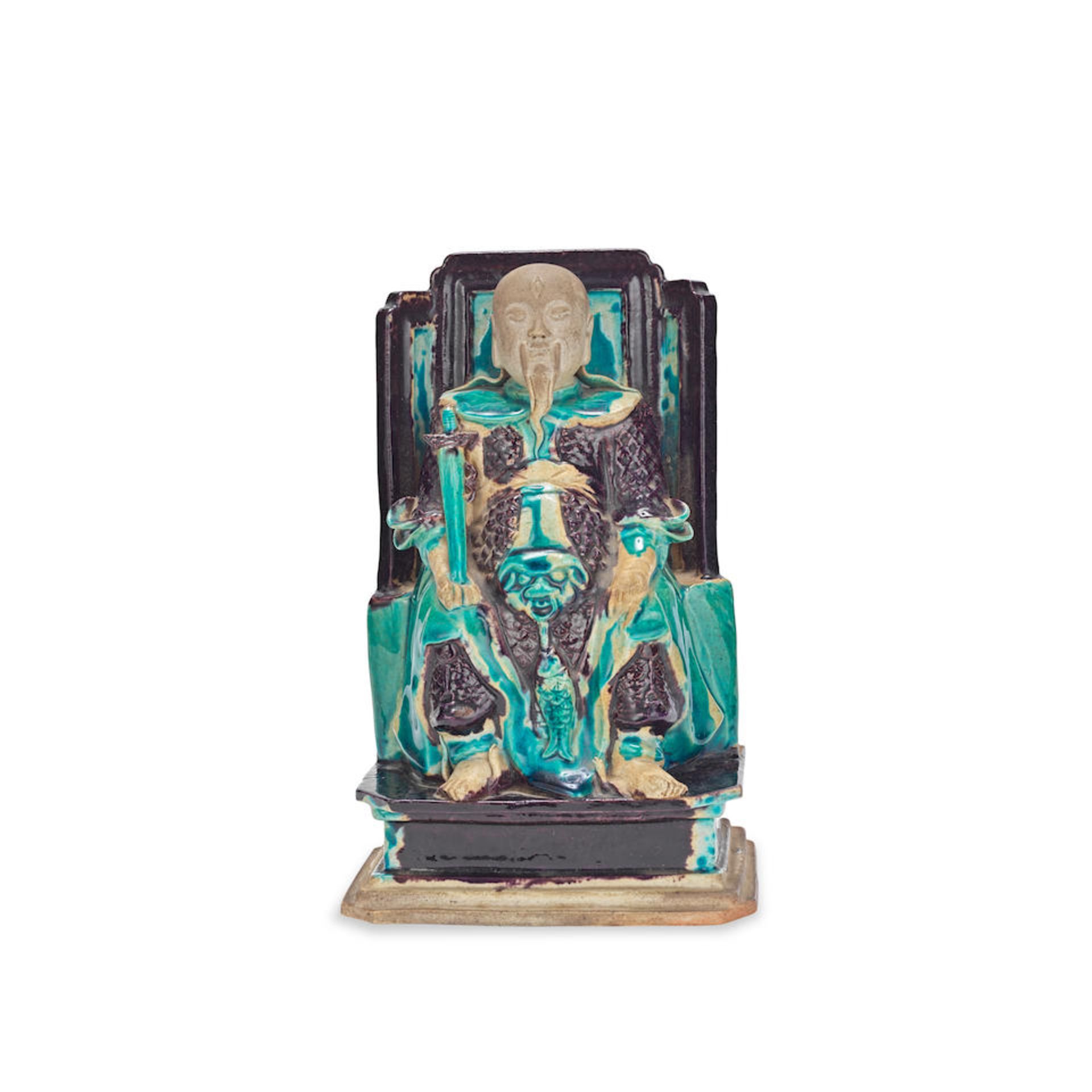 A TURQUOISE AND AUBERGINE FIGURE OF ZHENWU 17th century