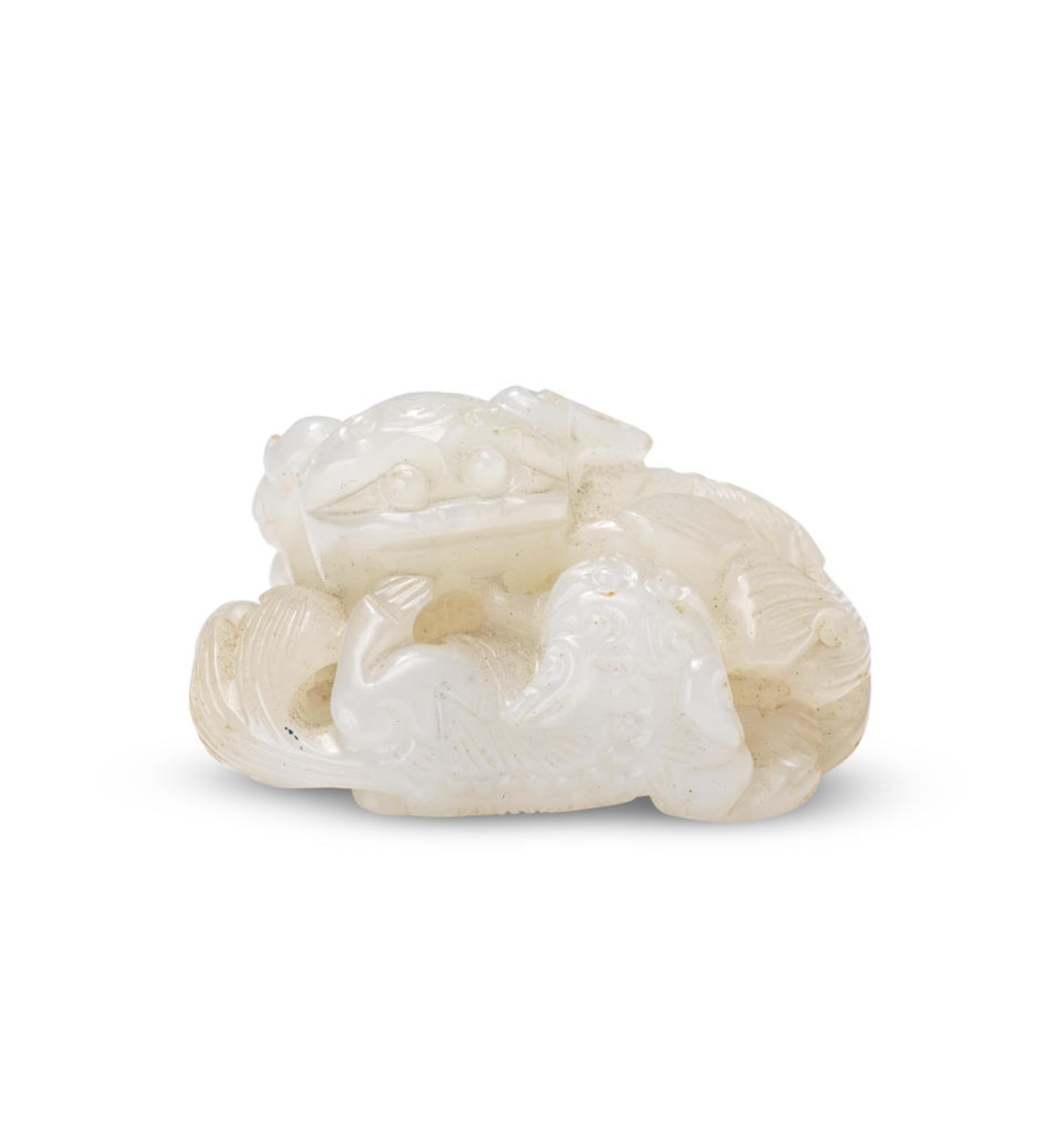 A WHITE JADE 'BUDDHIST LIONS' GROUP CARVING 18th/19th century (2)