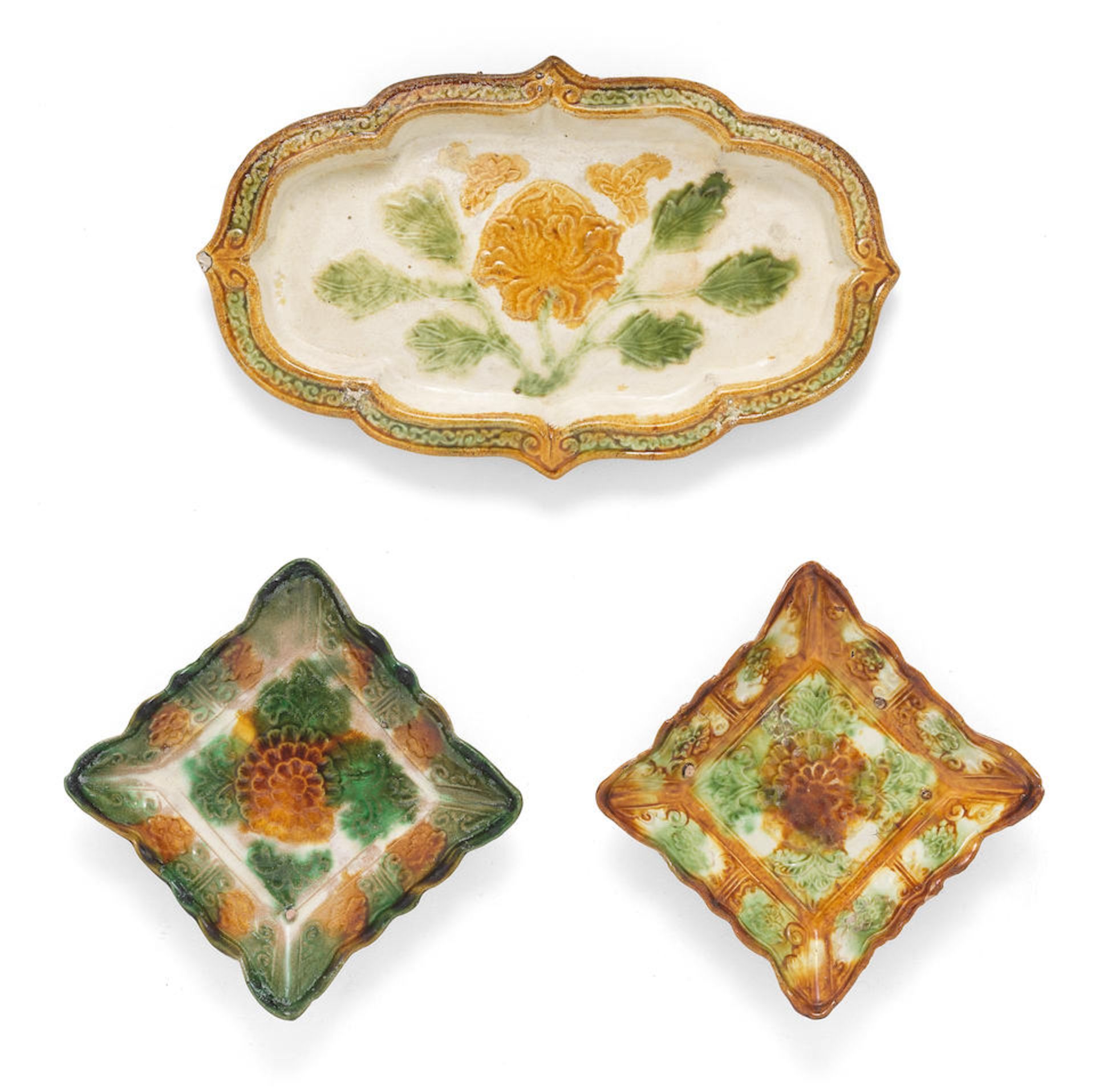 A PAIR OF SANCAI-GLAZED SQUARE DISHES AND A SANCAI-GLAZED QUATREFOIL 'LOTUS' DISH Liao Dynasty (3)