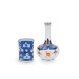 A BLUE AND WHITE BRUSHPOT AND A COPPER-RED DECORATED BOTTLE VASE Kangxi (2)