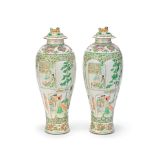 A PAIR OF FAMILLE ROSE BALUSTER VASES AND COVERS 19th century (4)