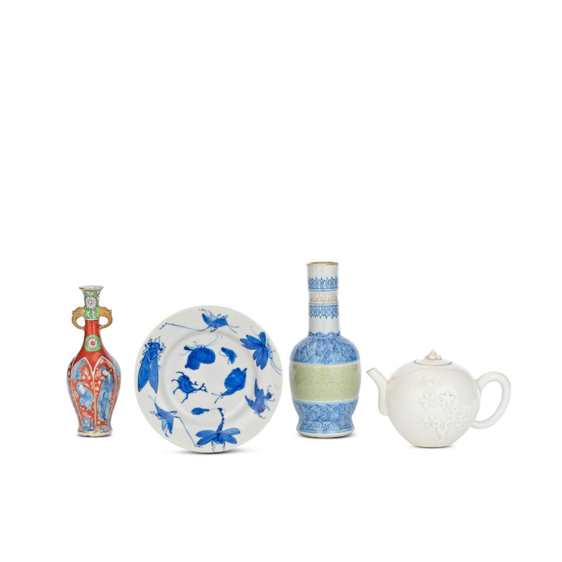 AN UNDERGLAZE BLUE AND COPPER RED CELADON GLAZED VASE, A BLANC-DE-CHINE TEAPOT AND COVER, A CLOB...