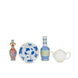 AN UNDERGLAZE BLUE AND COPPER RED CELADON GLAZED VASE, A BLANC-DE-CHINE TEAPOT AND COVER, A CLOB...