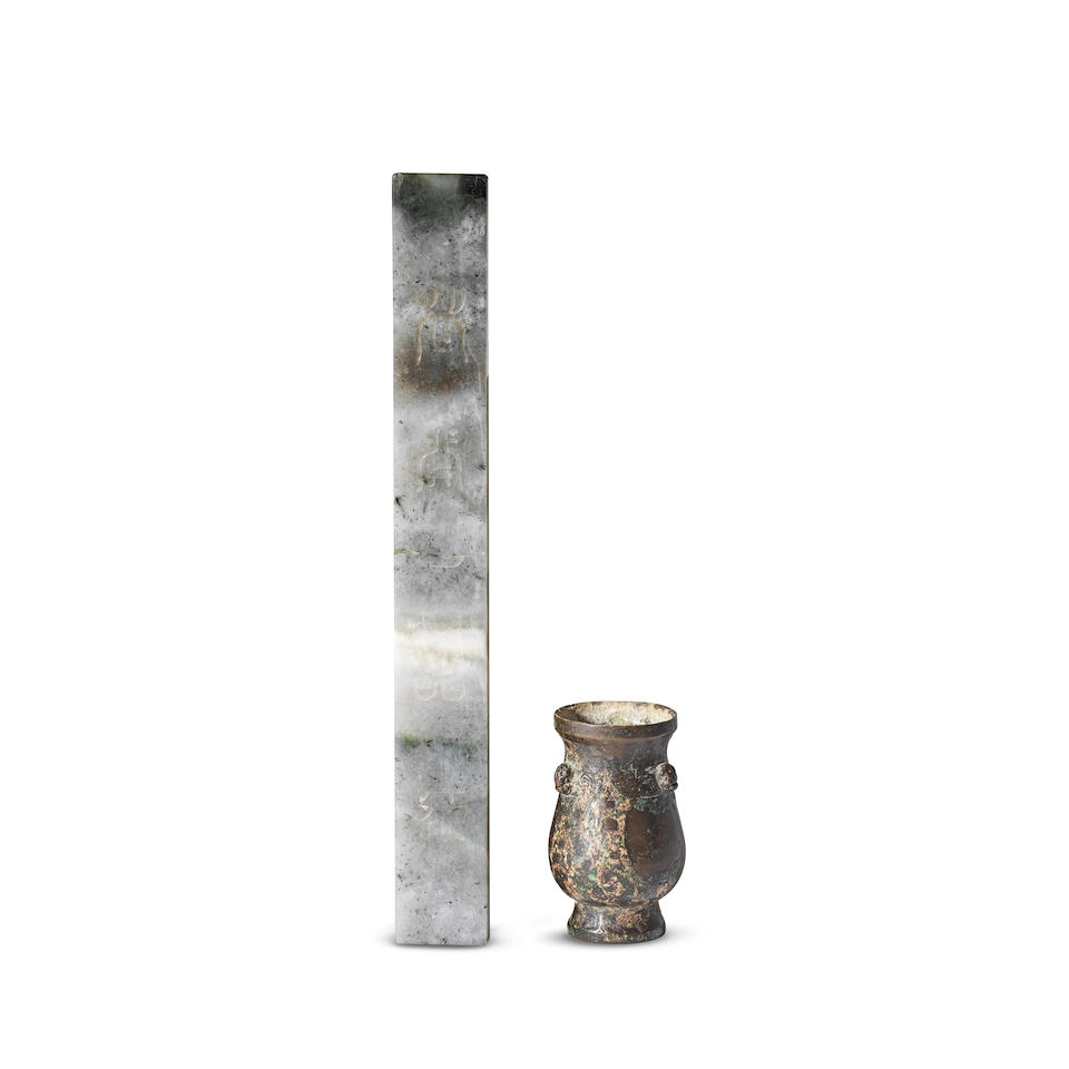 A PALE GREEN AND GREY JADE SCROLL WEIGHT AND A BRONZE TOOL VASE Han Dynasty and 19th/20th centur...