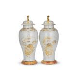 A PAIR OF GILT-DECORATED WHITE ENAMELLED VASES AND COVERS 20th century (4)