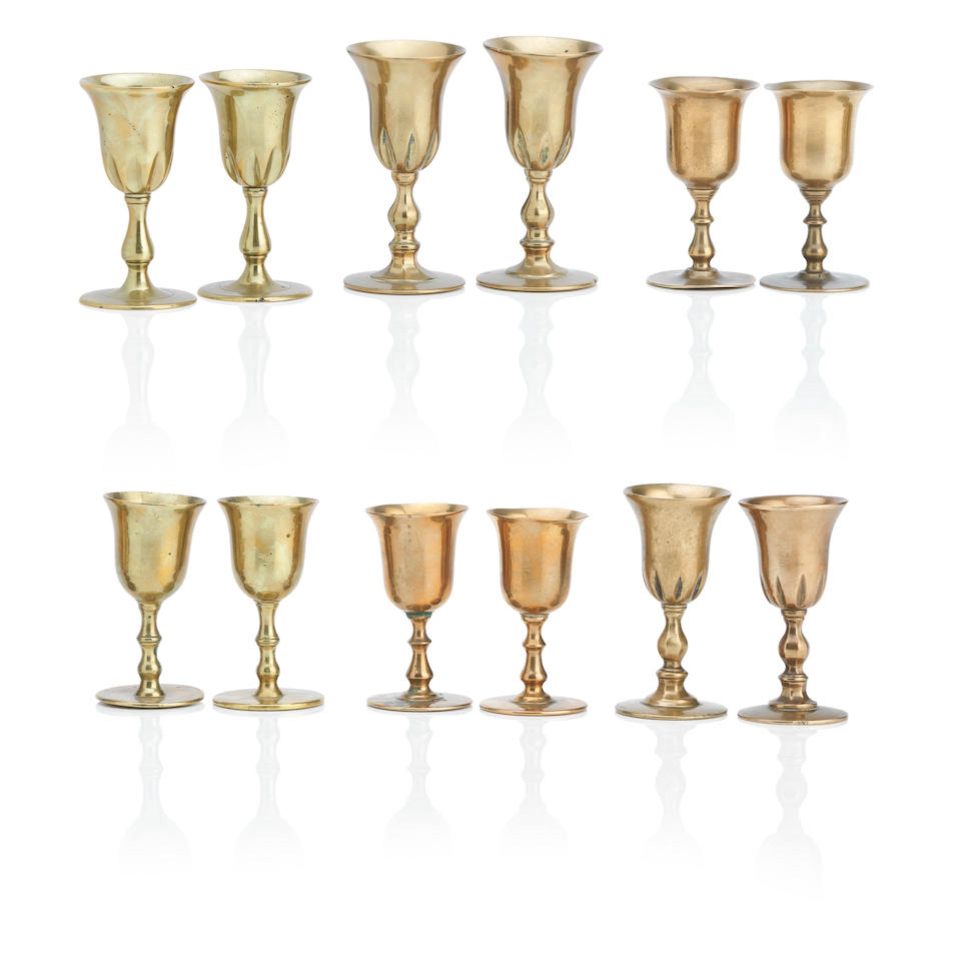 Five pairs and one near pair of Scottish copper alloy travelling communion cups 18th/19th Century