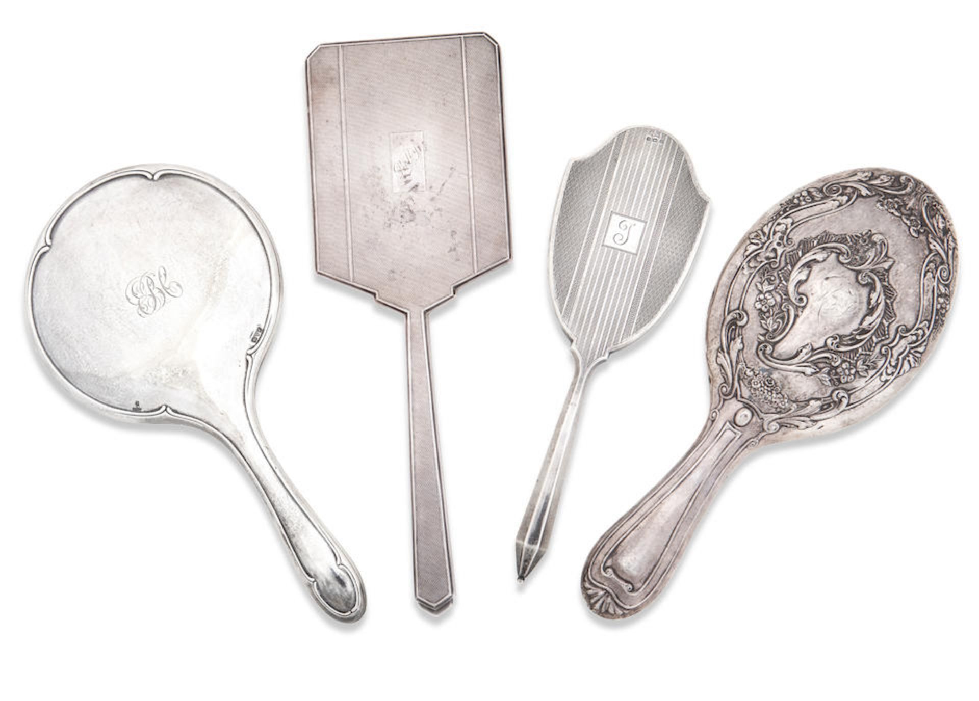 Four silver hand-mirrors Various makers and dates