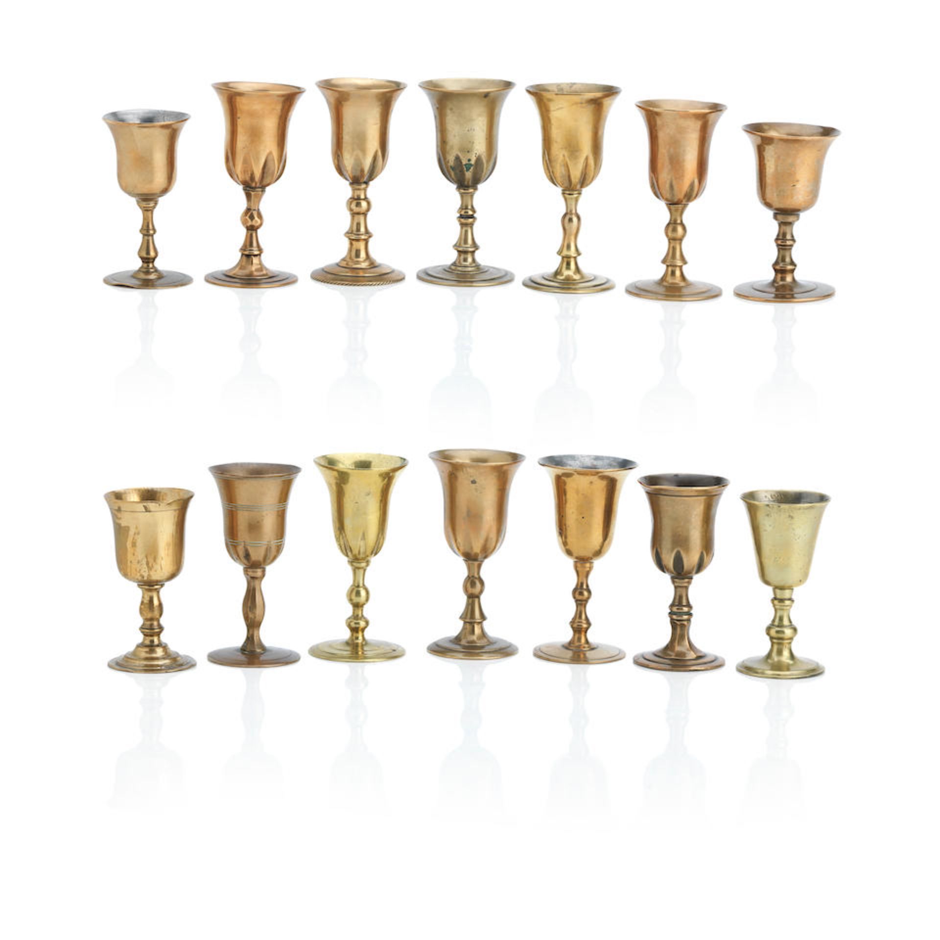 Fourteen Scottish copper alloy travelling communion cups 18th/19th Century