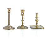 Three copper alloy candlesticks 16th/17th Century