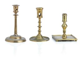 Three copper alloy candlesticks 16th/17th Century
