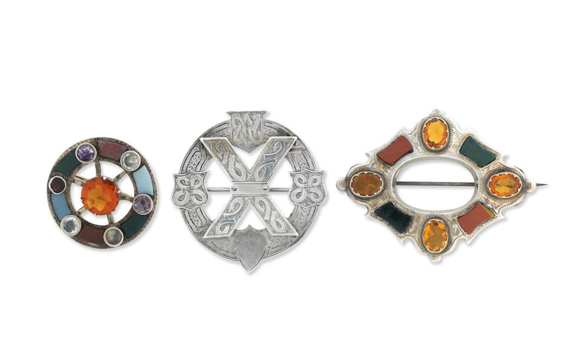 Two Scottish gem-set and hardstone brooches and a silver brooch (3)