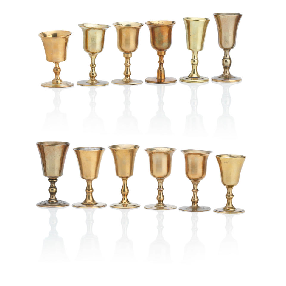 Twelve Scottish copper alloy travelling communion cups 18th/19th Century