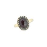 A garnet and seed-pearl ring