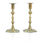 A large named pair of English rococo brass candlesticks Stamped 'Wm.LEE', circa 1760