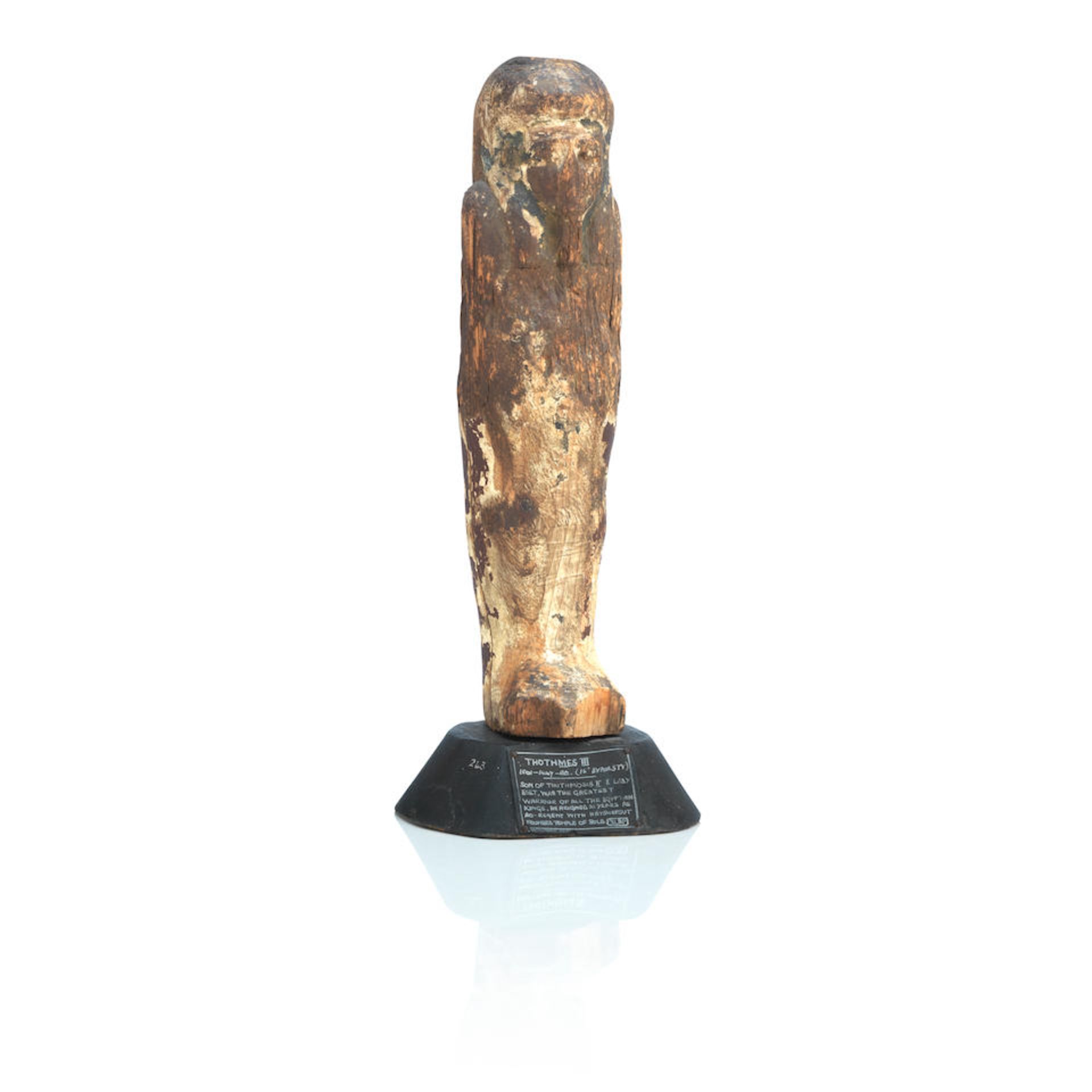 An ancient Egyptian carved wooden figure