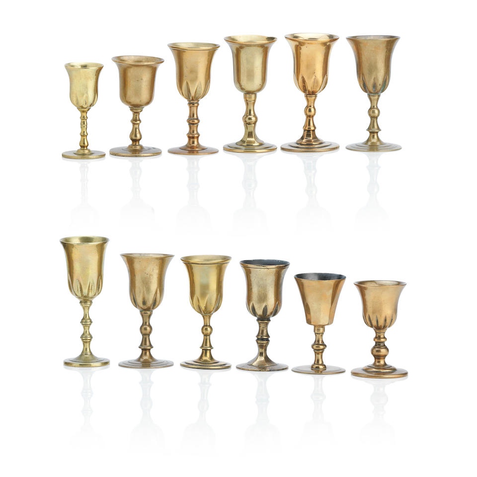 Twelve Scottish copper alloy travelling communion cups 18th/19th Century