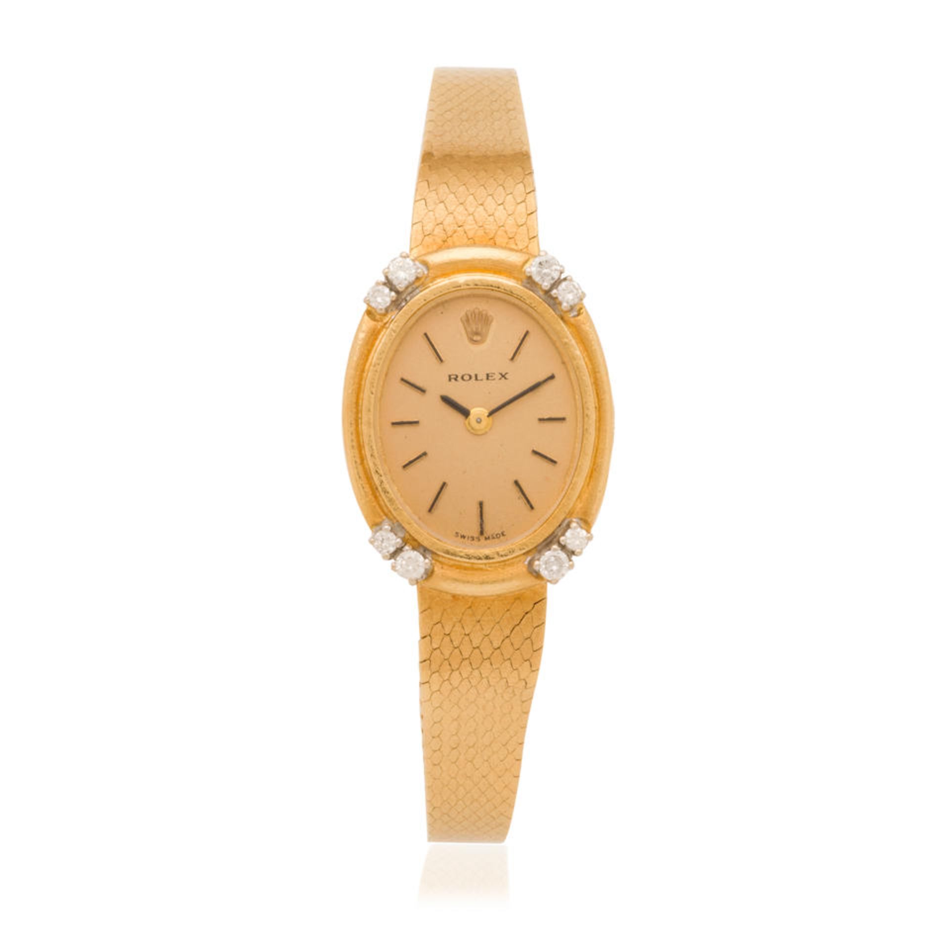 Rolex. A lady's 18K gold and diamond set bezel manual wind bracelet watch Rolex. Montre bracelet...