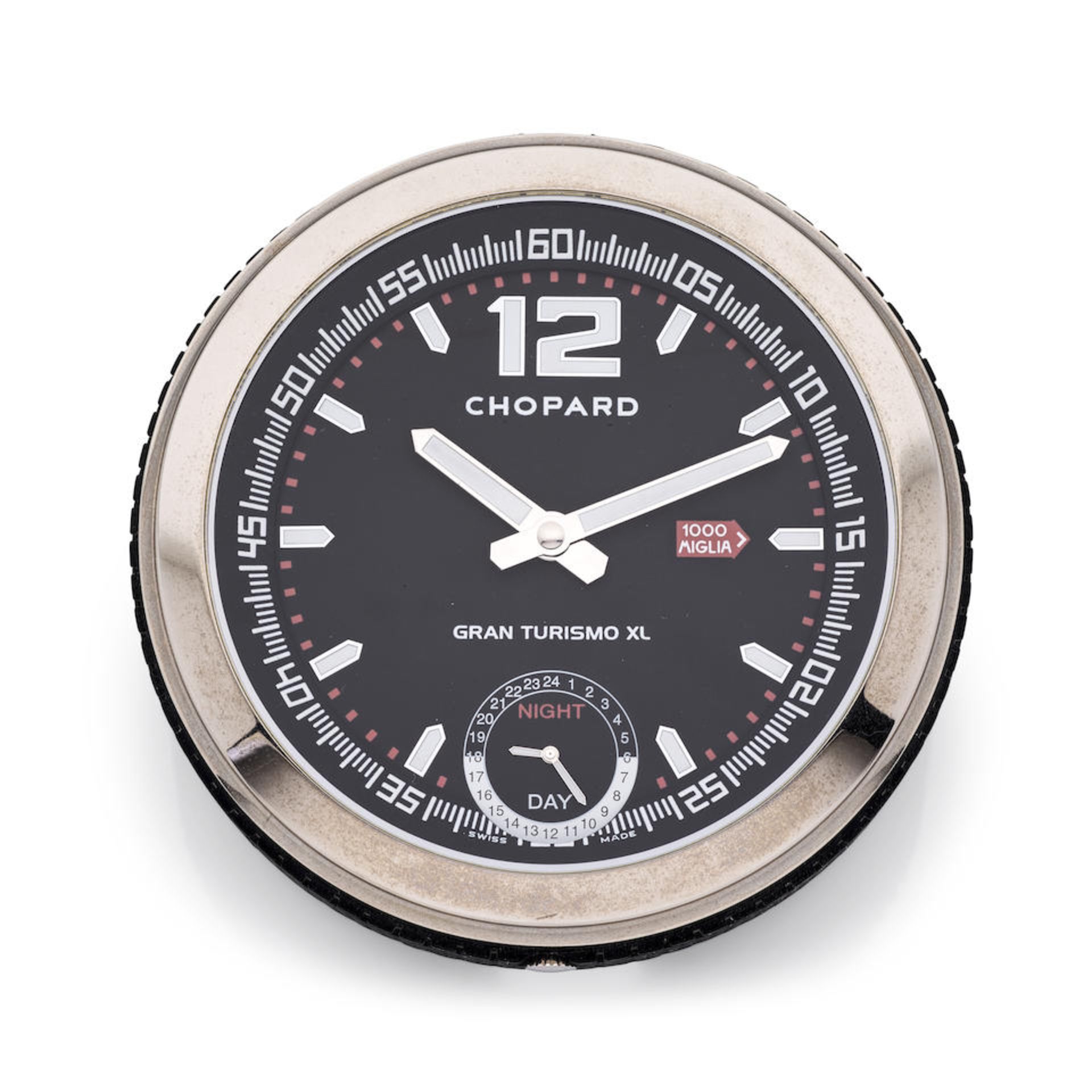 Chopard. A stainless steel and black rubber quartz night & day desk clock Chopard. Horloge de bu...