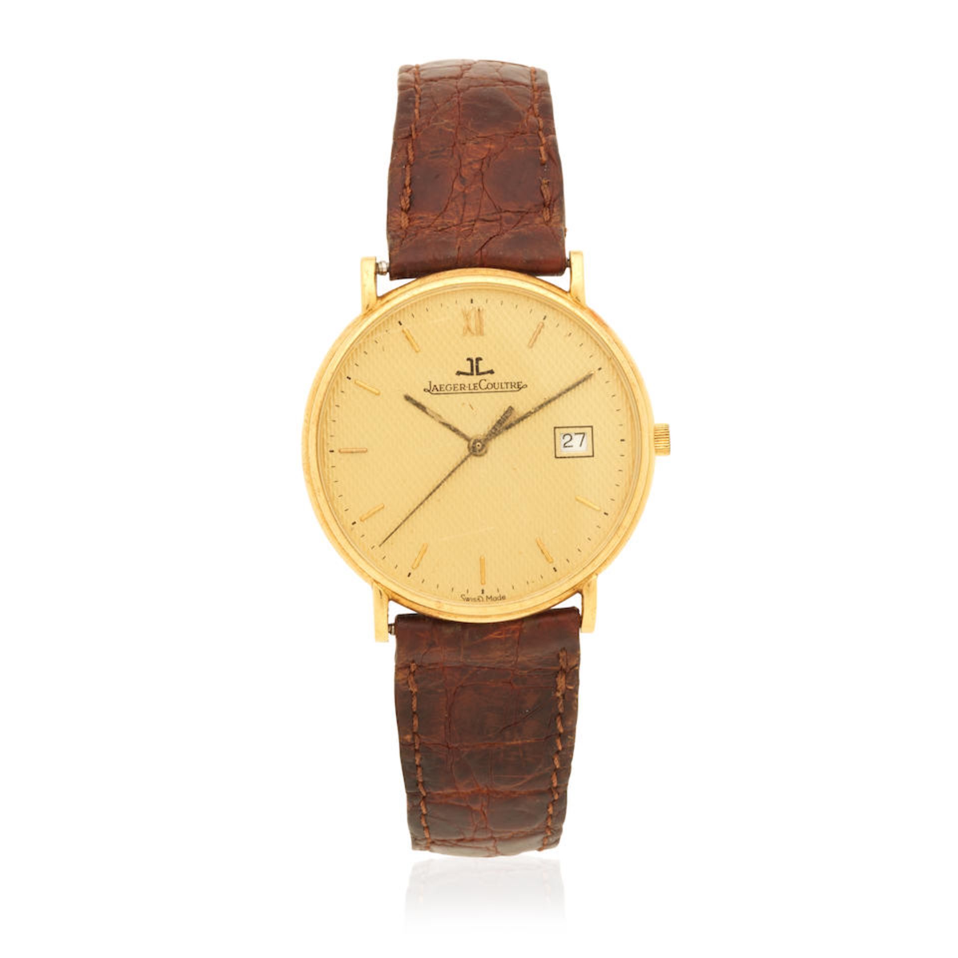 Jaeger-LeCoultre. An 18K gold quartz calendar wristwatch Jaeger-LeCoultre. Montre bracelet en or...