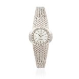 Longines. A lady's 18K white gold manual wind bracelet watch with diamond set bezel Longines. Mo...