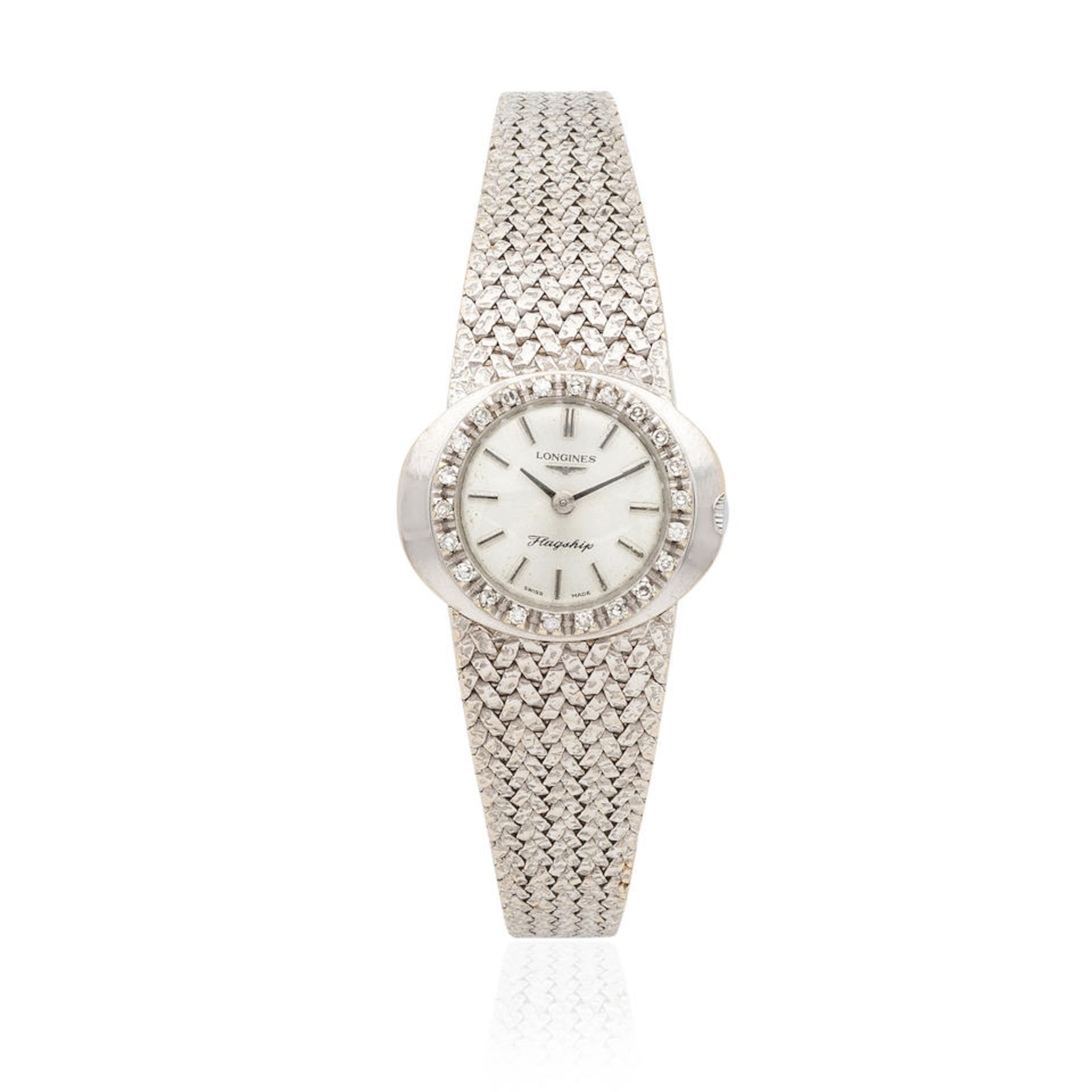 Longines. A lady's 18K white gold manual wind bracelet watch with diamond set bezel Longines. Mo...