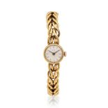Baume & Mercier. A lady's 18K gold manual wind bracelet watch Baume & Mercier. Montre bracelet d...