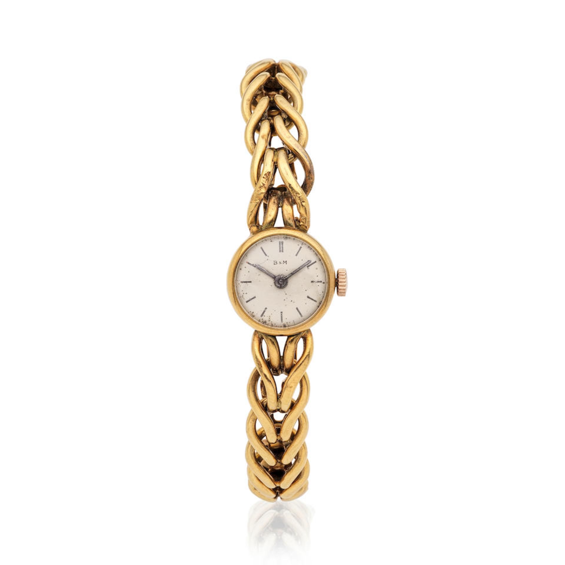 Baume & Mercier. A lady's 18K gold manual wind bracelet watch Baume & Mercier. Montre bracelet d...