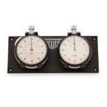 Heuer. Lot de deux chronographes stopwatch compteurs de bord en acier remontoir au pendant Heuer...