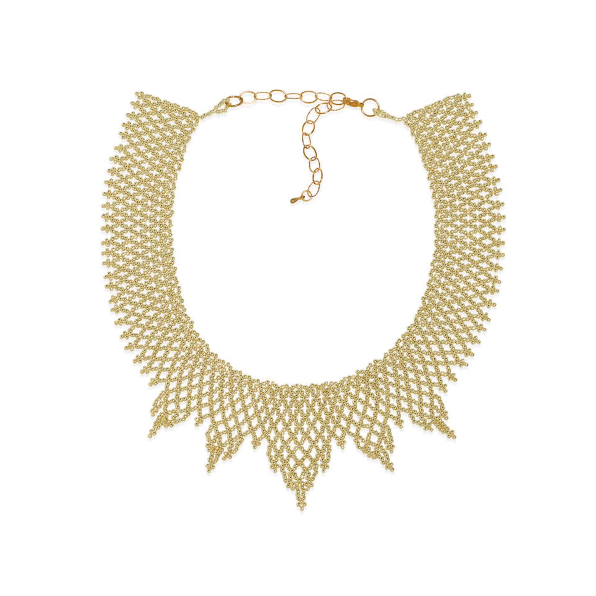 A RUTH BADER GINSBURG BEADED JUDICIAL COLLAR. A beaded collar necklace featuring round gilt glas...