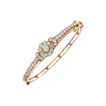 A GOLD AND DIAMOND BANGLE BRACELET